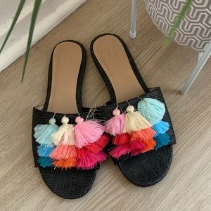 Black slide sandals with rainbow tassels